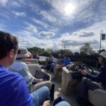 A group tours a marsh aboard a small boat